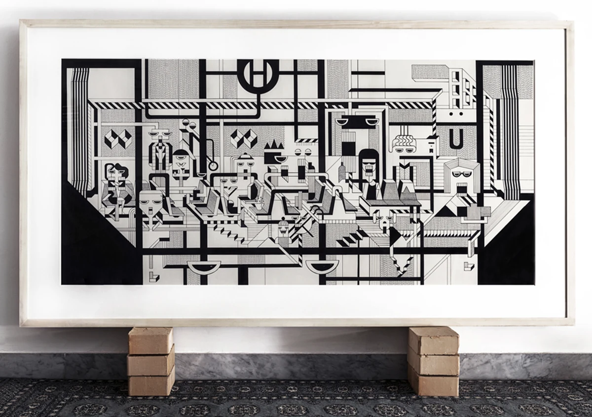 Framed U Berlin ink drawing from the BAI series, displayed on brick supports above a patterned rug.