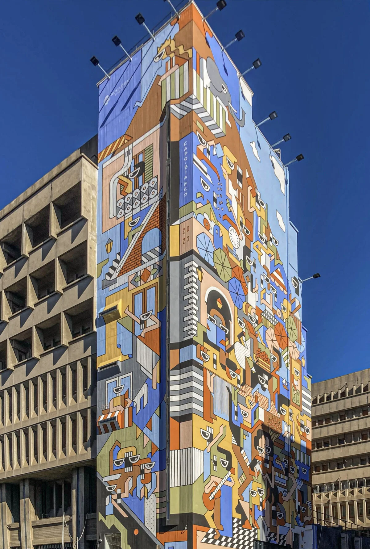 Banco di Vita covering the tall Bank of Italy building in central Catania.
